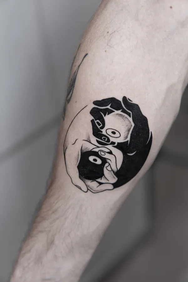 Yin yang hands with cartoon faces forearm tattoo Bangkok by Ballin