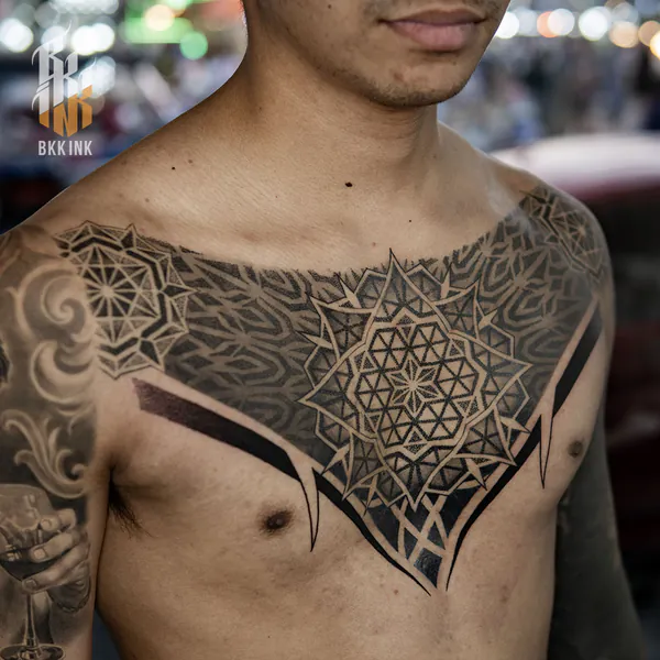 Sacred geometry flower chest blackwork tattoo Bangkok