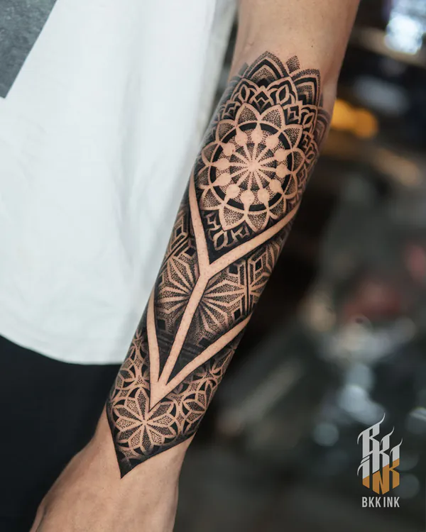 Mandala geometric forearm blackwork tattoo Bangkok