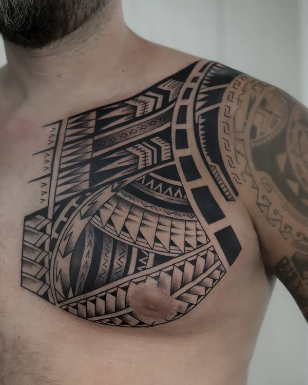 Polynesian tribal chest blackwork tattoo Bangkok