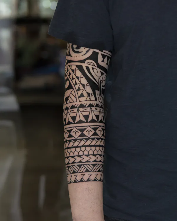 Polynesian tribal arm sleeve blackwork tattoo Bangkok