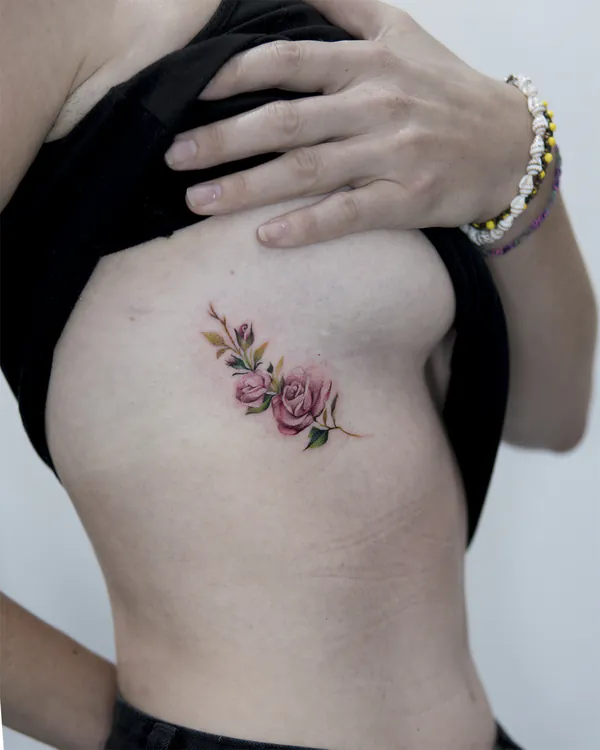 Pink rose bouquet side ribs feminine tattoo Bangkok