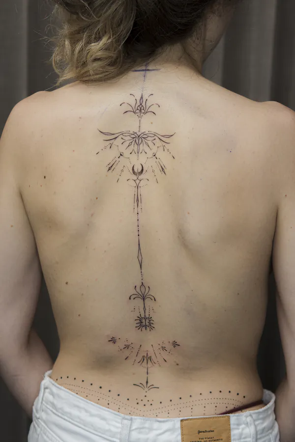 Ornate filigree mandala spine feminine girly tattoo Bangkok