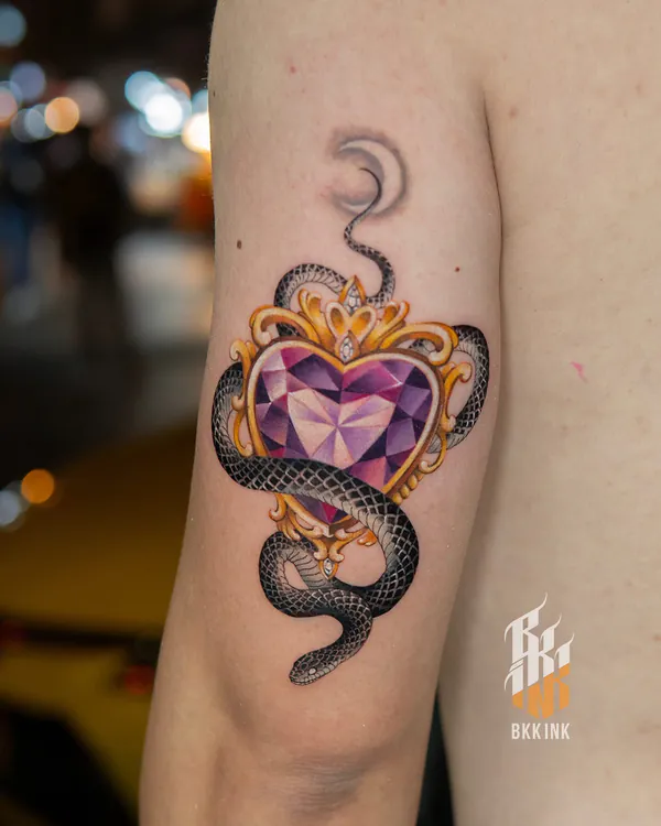 Gem heart with snake upper arm feminine girly tattoo Bangkok