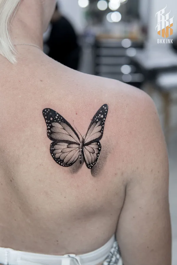 Realistic monarch butterfly shoulder blade feminine tattoo Bangkok