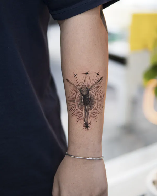 Radiant figure with stars forearm fine line tattoo Bangkok