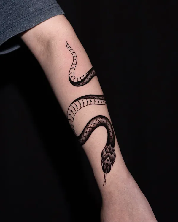 Coiled snake forearm fine line tattoo Bangkok