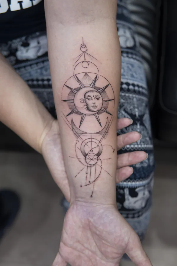 Sun and moon mandala inner forearm fine line tattoo Bangkok