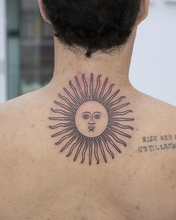 Sun face motif upper back fine line tattoo Bangkok