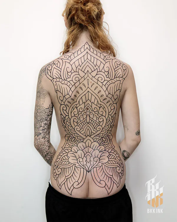 Ornamental lotus mandala back tattoo Bangkok by Hack