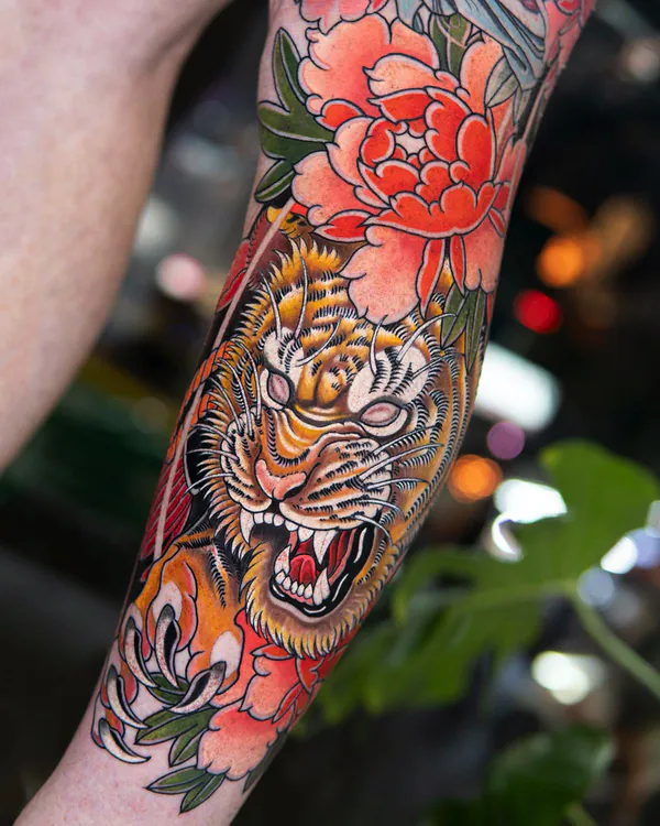 Roaring tiger and peony arm Japanese tattoo Bangkok