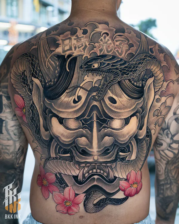 Hannya mask, snake and clouds back piece Japanese tattoo Bangkok