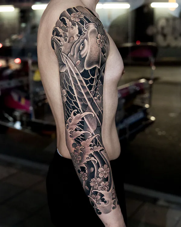 Koi fish and waves arm sleeve Japanese tattoo Bangkok