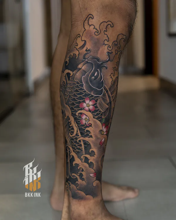 Leaping koi and cherry blossom calf Japanese tattoo Bangkok