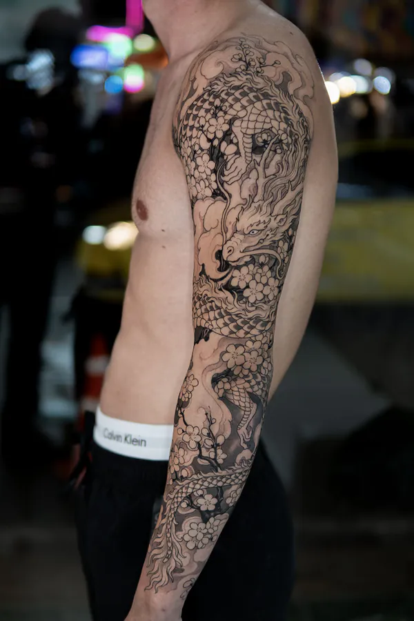 Dragon and cherry blossom full sleeve Japanese tattoo Bangkok