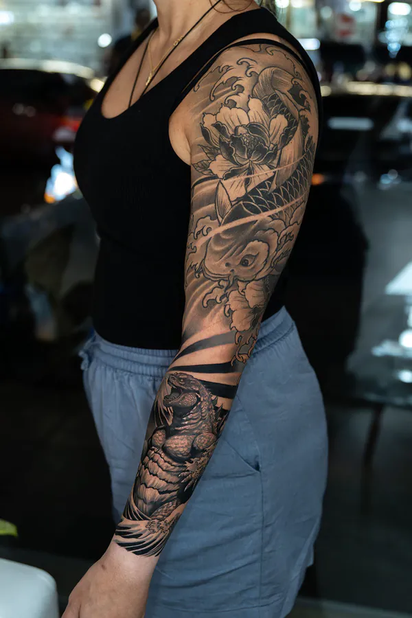 Peony, koi and turtle forearm sleeve Japanese tattoo Bangkok