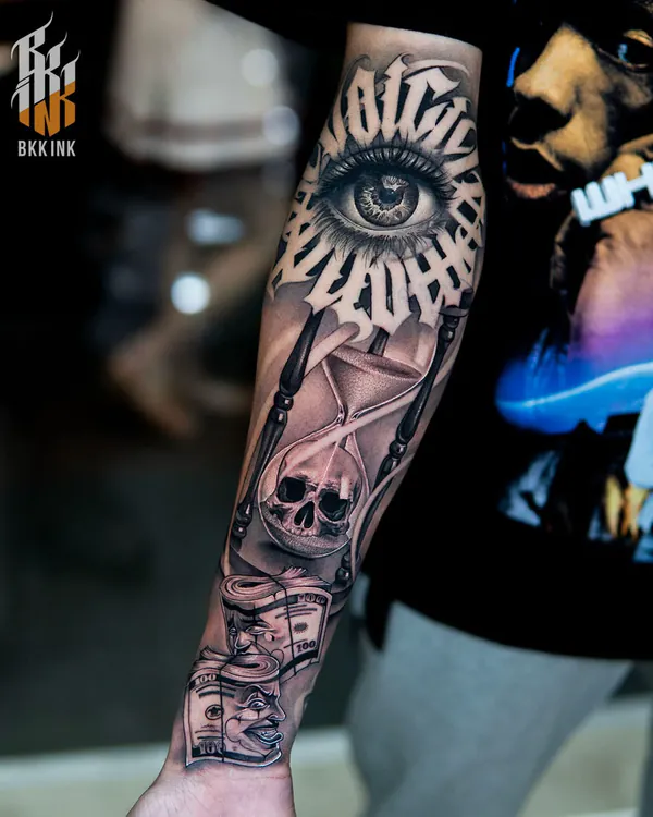 Gothic blackletter eye forearm lettering tattoo Bangkok