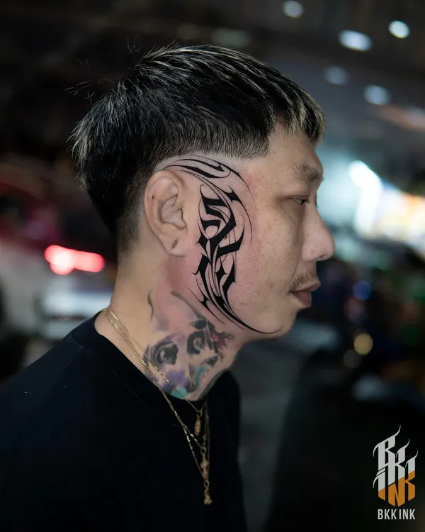 Tribal calligraphy script face lettering tattoo Bangkok