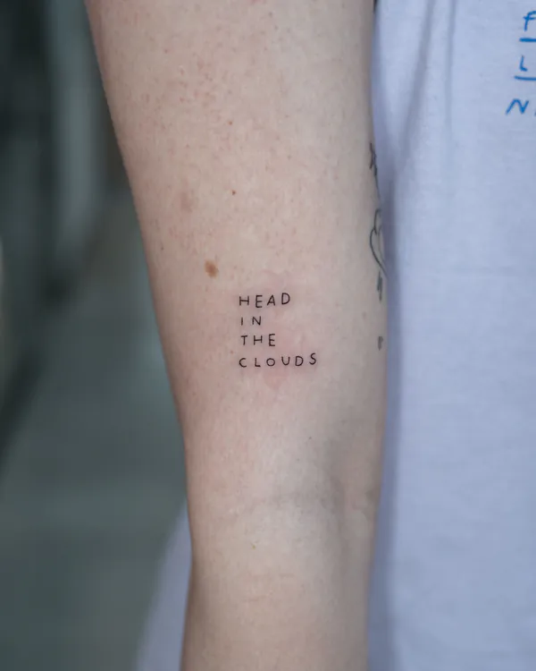 Small fine line quote forearm lettering tattoo Bangkok