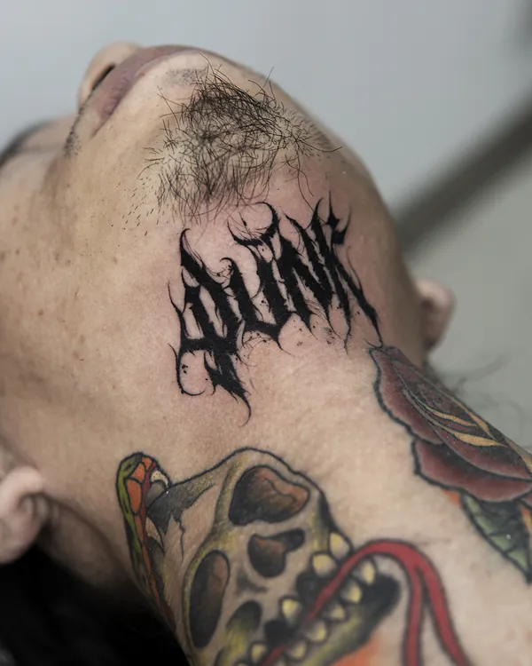 Spiky gothic word chin lettering tattoo Bangkok