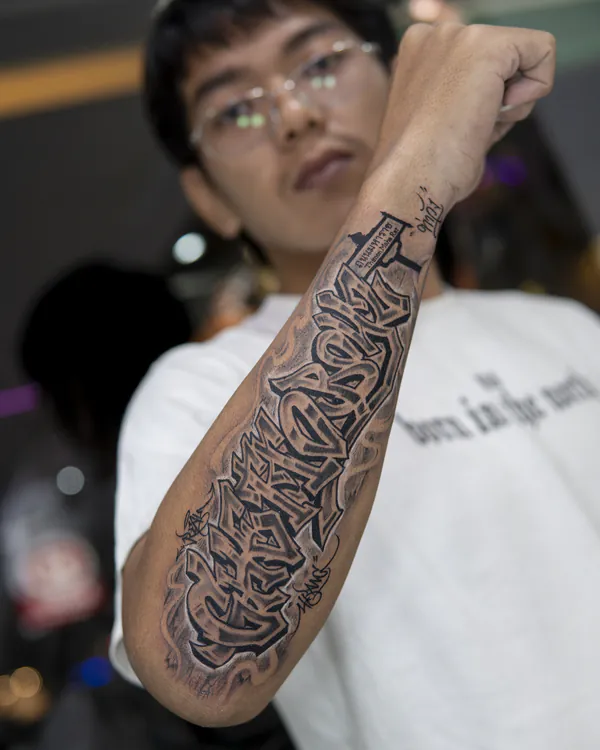 Wildstyle graffiti letters forearm lettering tattoo Bangkok