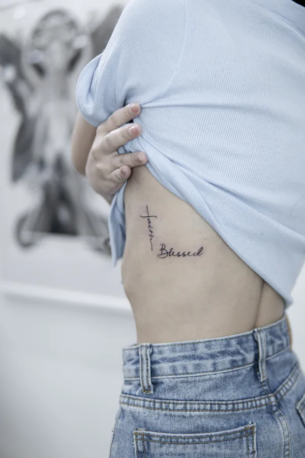 Fine line faith cross rib lettering tattoo Bangkok