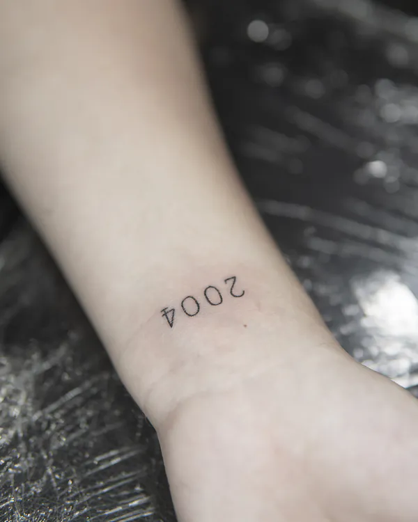 Small typewriter number wrist lettering tattoo Bangkok