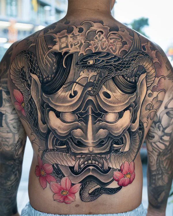 Hannya mask with coiling snake back piece tattoo Bangkok by Mhee