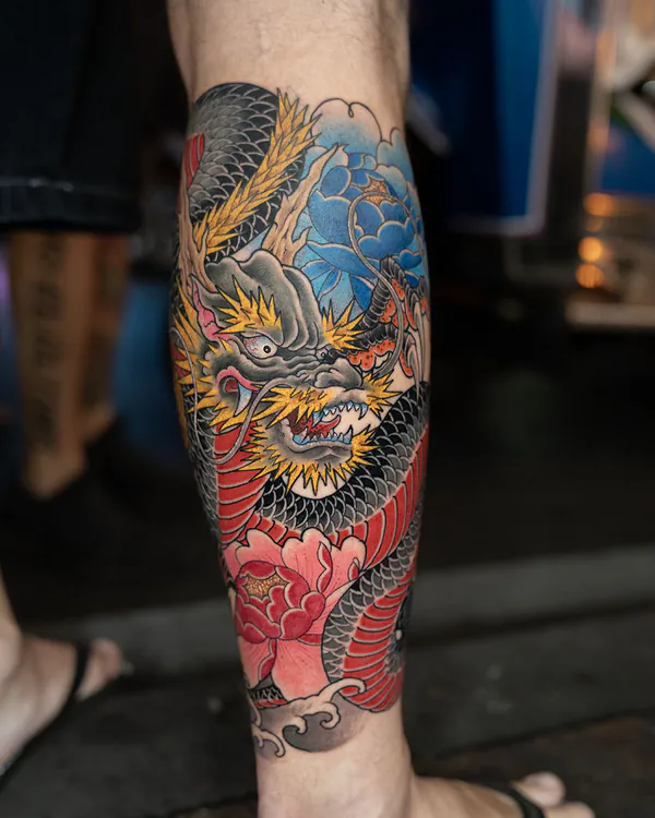 Color dragon with peony flowers calf tattoo Bangkok by Mhee