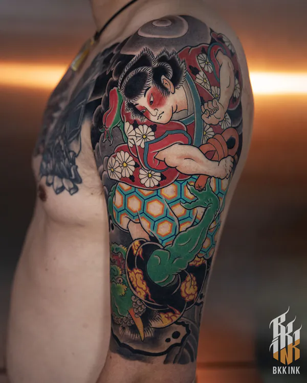 Japanese folklore figure with green serpent arm tattoo Bangkok by Mhee