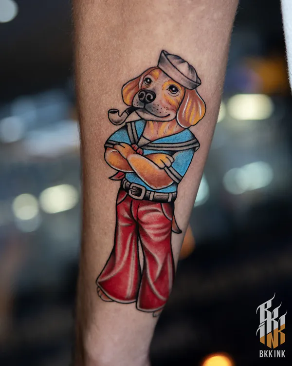 Cartoon sailor dog with pipe forearm tattoo Bangkok by Mor