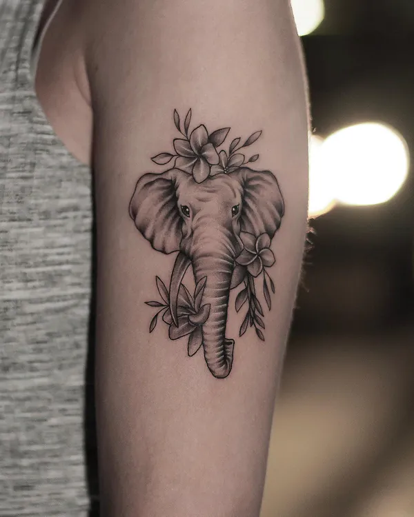 Elephant with plumeria flowers arm tattoo Bangkok by Mor