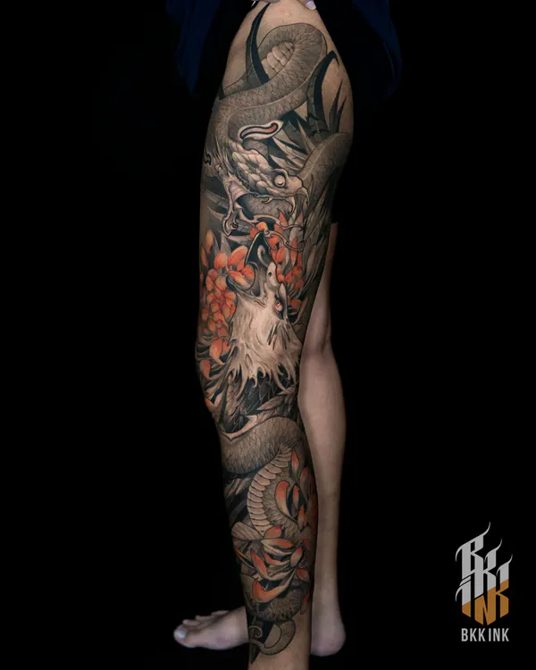 Black and grey dragon and crane leg sleeve neo-traditional tattoo Bangkok