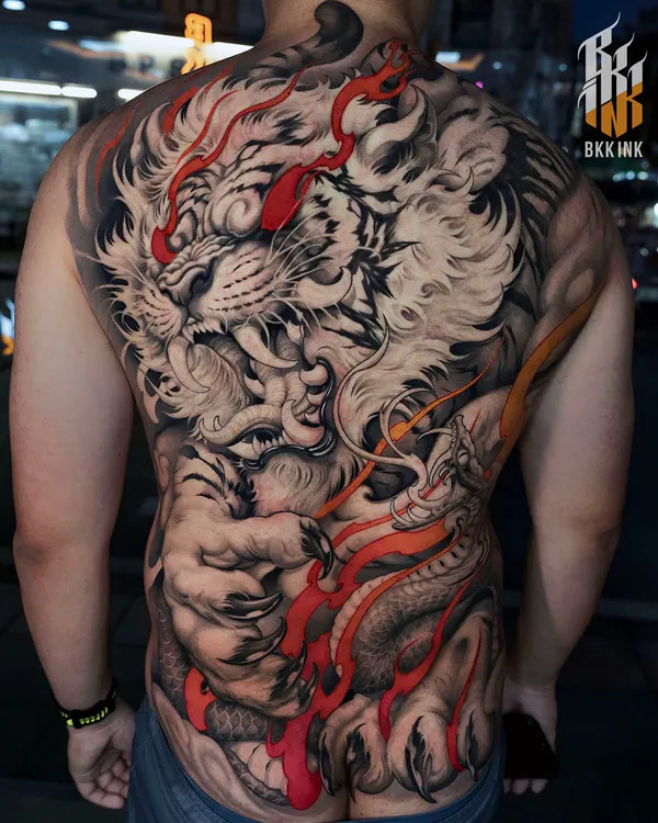 Black and grey tiger and dragon back piece neo-traditional tattoo Bangkok