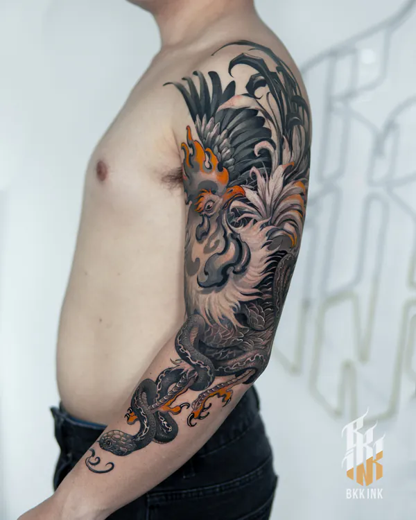 Black and grey rooster and snake arm sleeve neo-traditional tattoo Bangkok