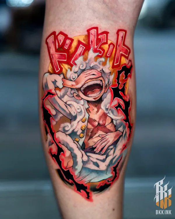 Colour laughing anime boy with kanji text calf neo-traditional tattoo Bangkok