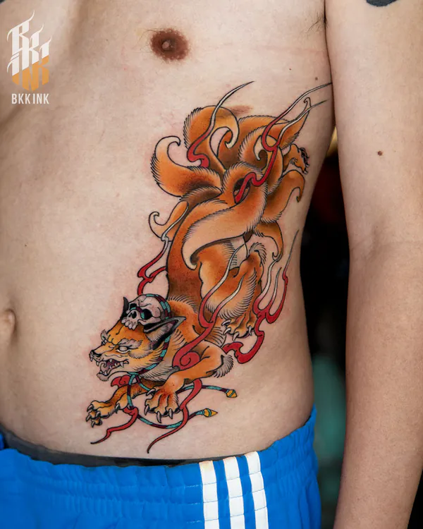 Colour orange fox with skull headdress ribs neo-traditional tattoo Bangkok