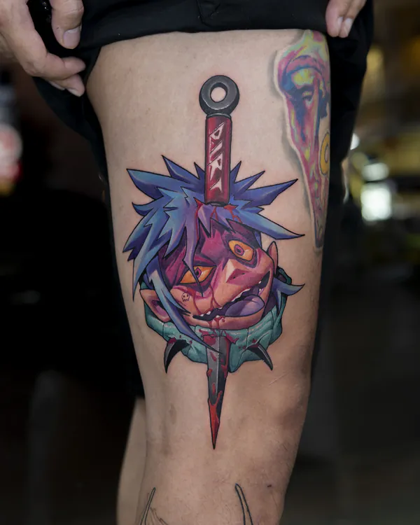 Dagger piercing demon face thigh new school tattoo Bangkok