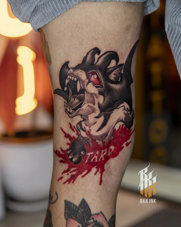 Snarling black wolf creature calf new school tattoo Bangkok