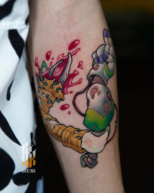 Robotic creature head with ice cream cone forearm new school tattoo Bangkok