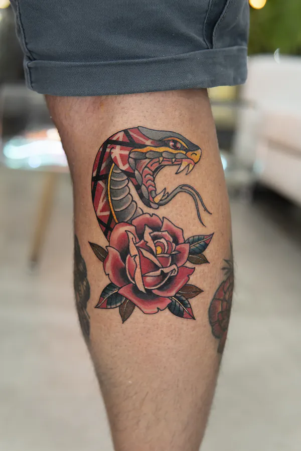 Cobra snake with rose calf old school tattoo Bangkok