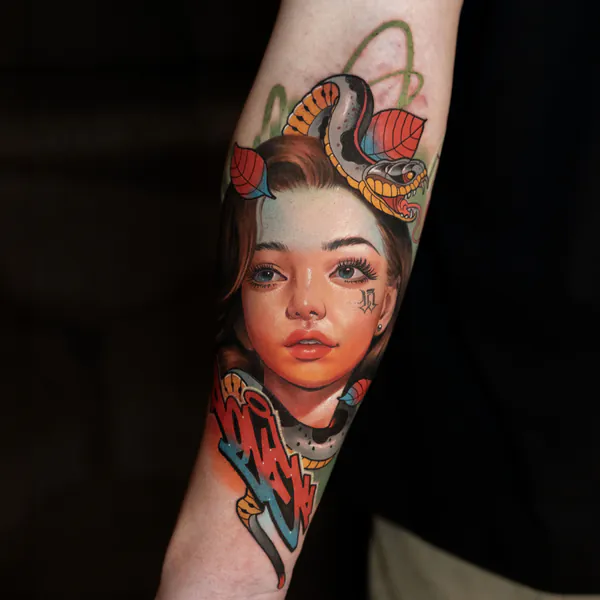 Colour woman portrait with snake forearm realistic tattoo Bangkok