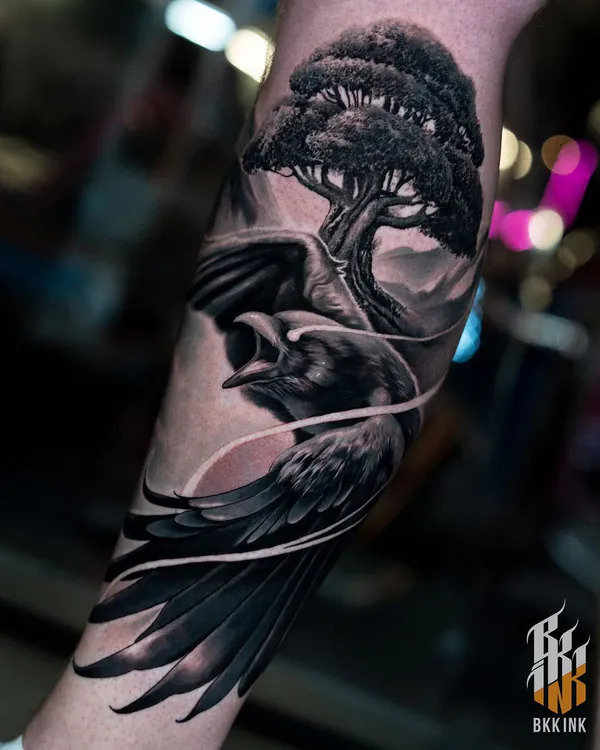 Raven with bonsai tree forearm realistic tattoo Bangkok