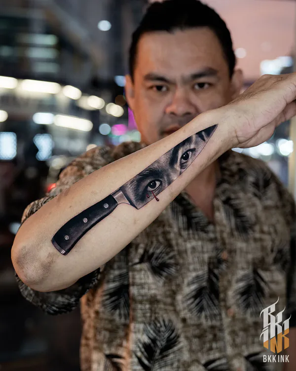 Knife with eyes forearm realistic tattoo Bangkok