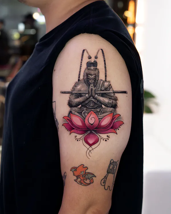 Colour monkey king with lotus upper arm realistic tattoo Bangkok