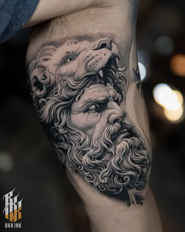 Bearded man in lion pelt upper arm realistic tattoo Bangkok