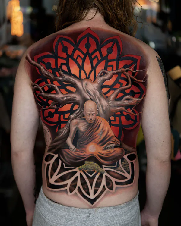 Colour meditating monk under tree full back realistic tattoo Bangkok