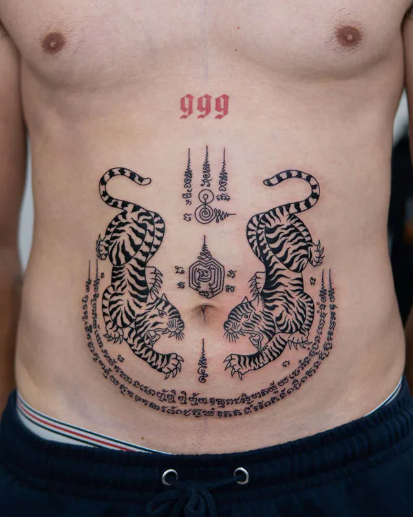 Twin tigers 999 numerals abdomen Sak Yant tattoo Bangkok