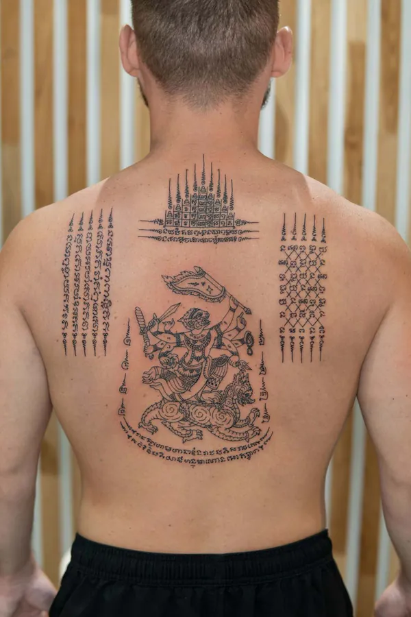 Warrior deity naga full back Sak Yant tattoo Bangkok