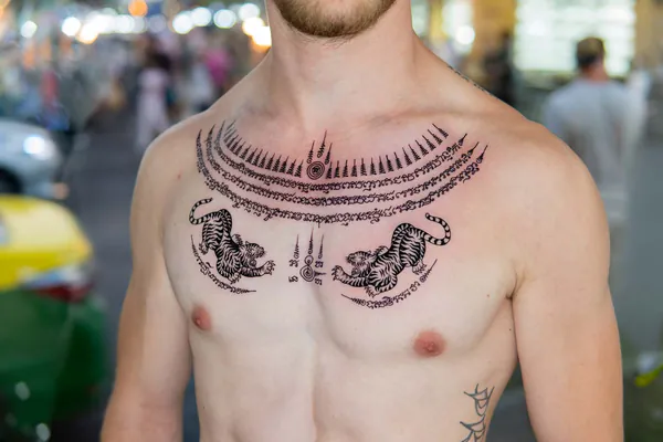 Twin tigers scalloped arch chest Sak Yant tattoo Bangkok